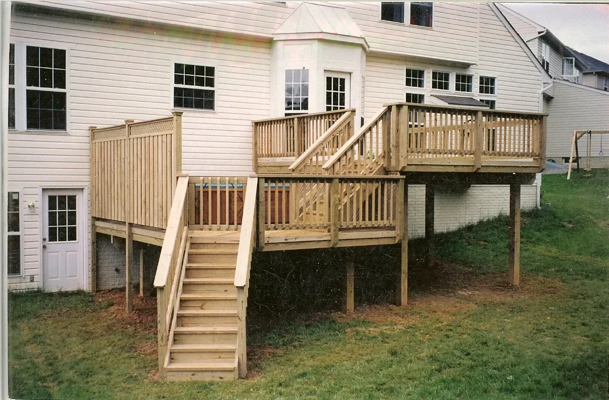Custom wood deck with sunroom addition
